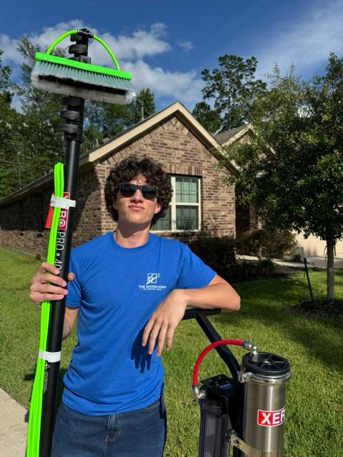 Liam White with professional window cleaning equipment