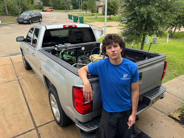 Liam White, owner of The Woodlands Exterior Care, with his work truck